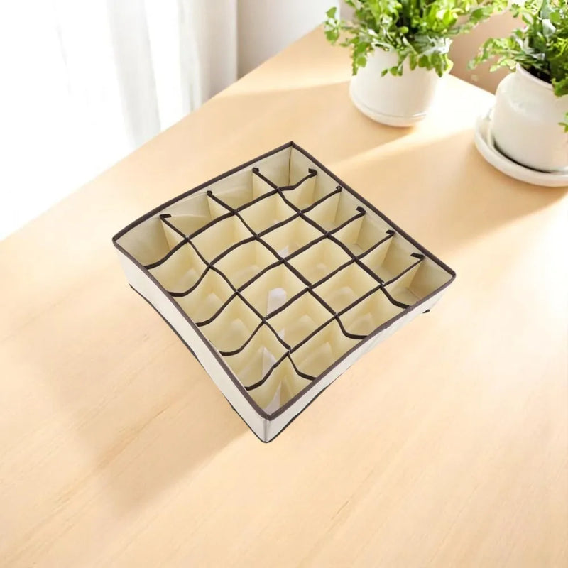 Organizador de gavetas com 24 divisões para roupas portáteis, dobragem de roupas e organização interna de objetos.